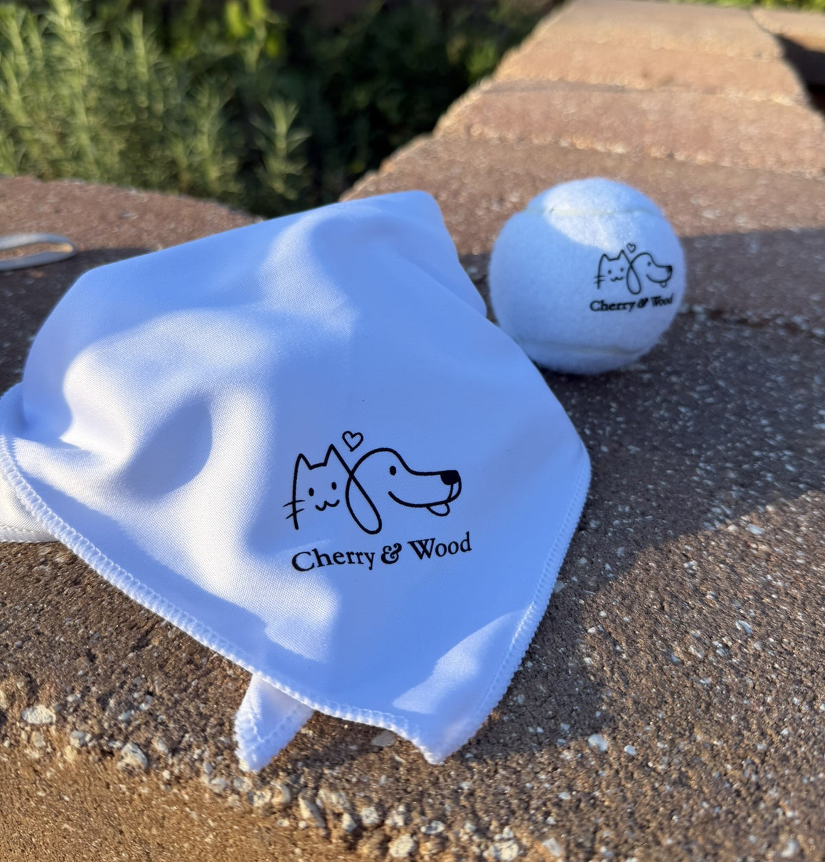 White pet bandana styled with a tennis ball
